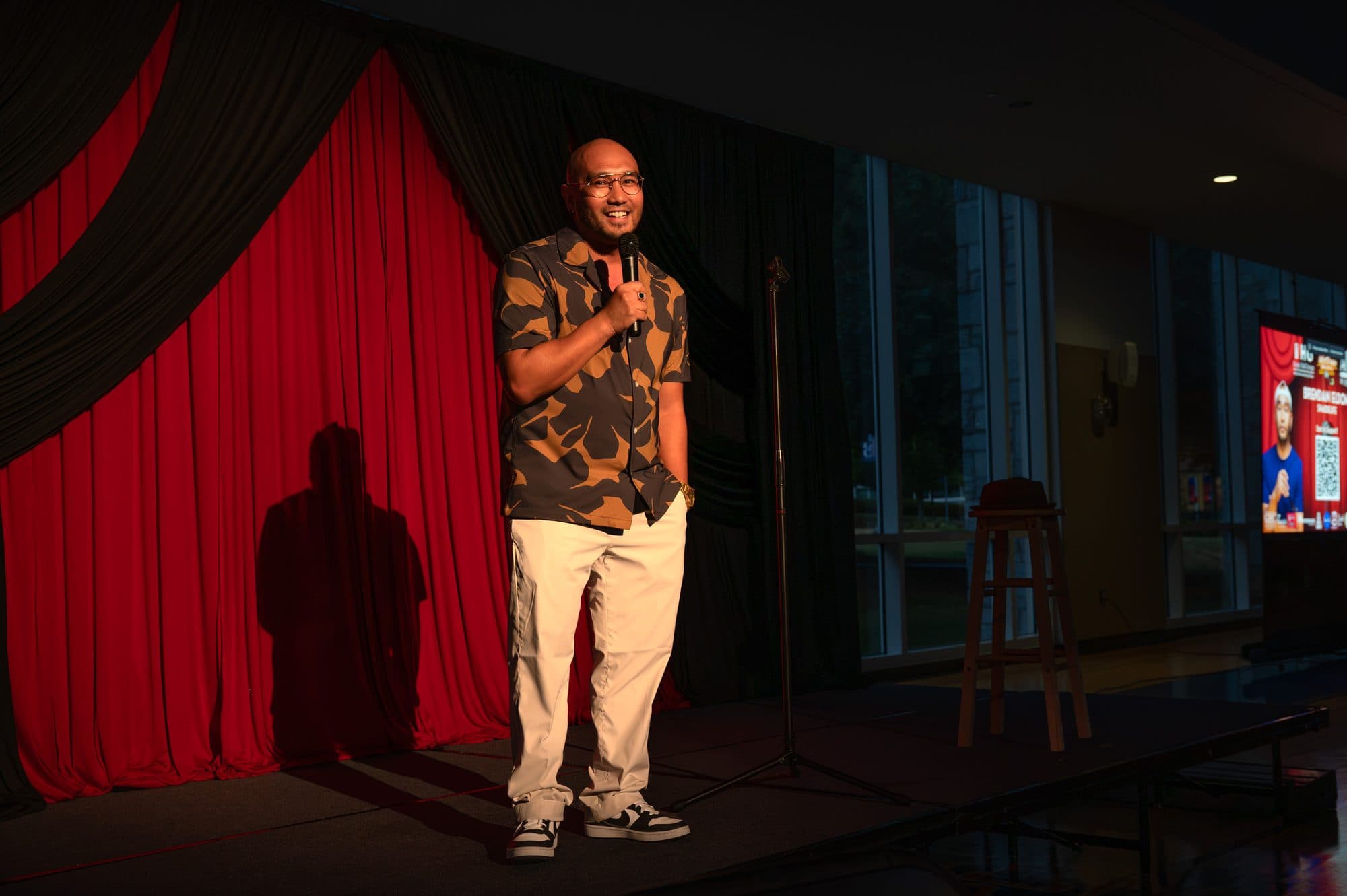 Comedian performing a stand-up set on stage at Mic Drop Masters 2026.