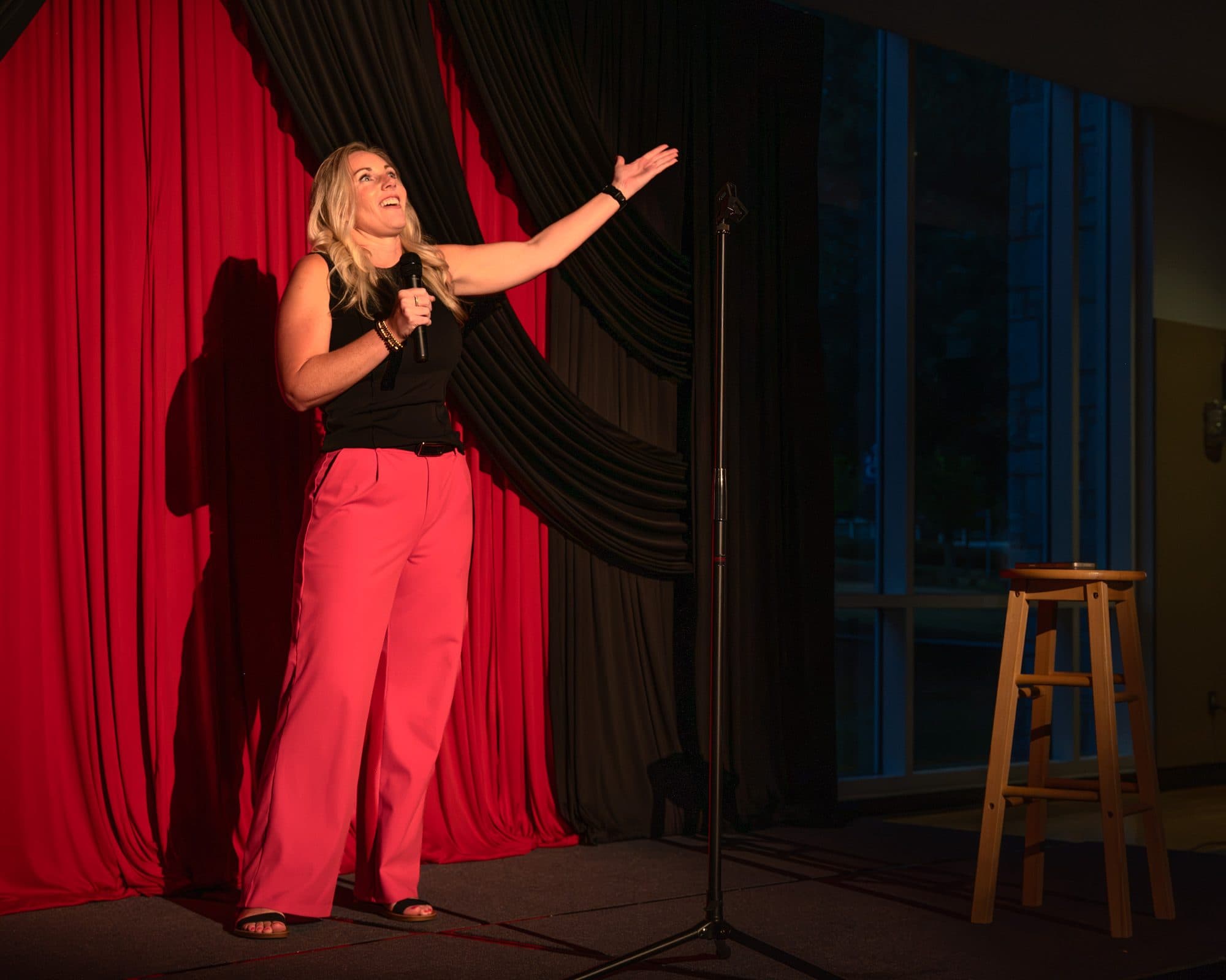 Comedian performing a stand-up set on stage at Mic Drop Masters 2026.