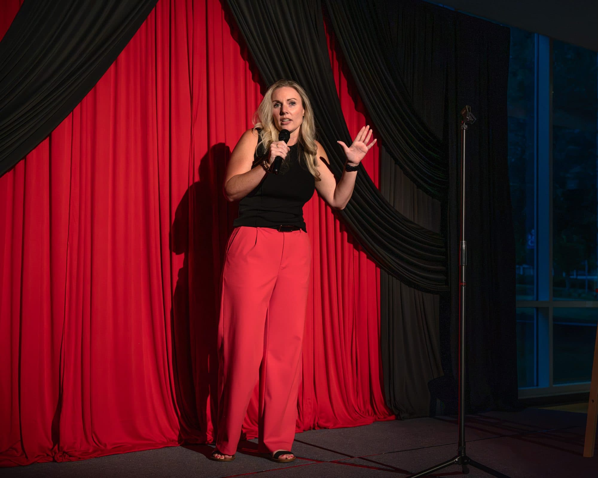 Comedian performing a stand-up set on stage at Mic Drop Masters 2026.