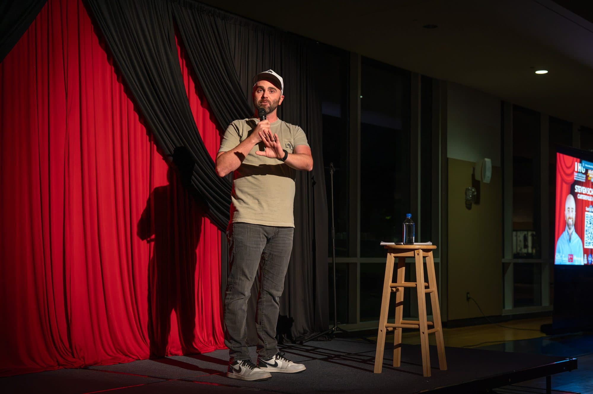 Comedian performing a stand-up set on stage at Mic Drop Masters 2026.