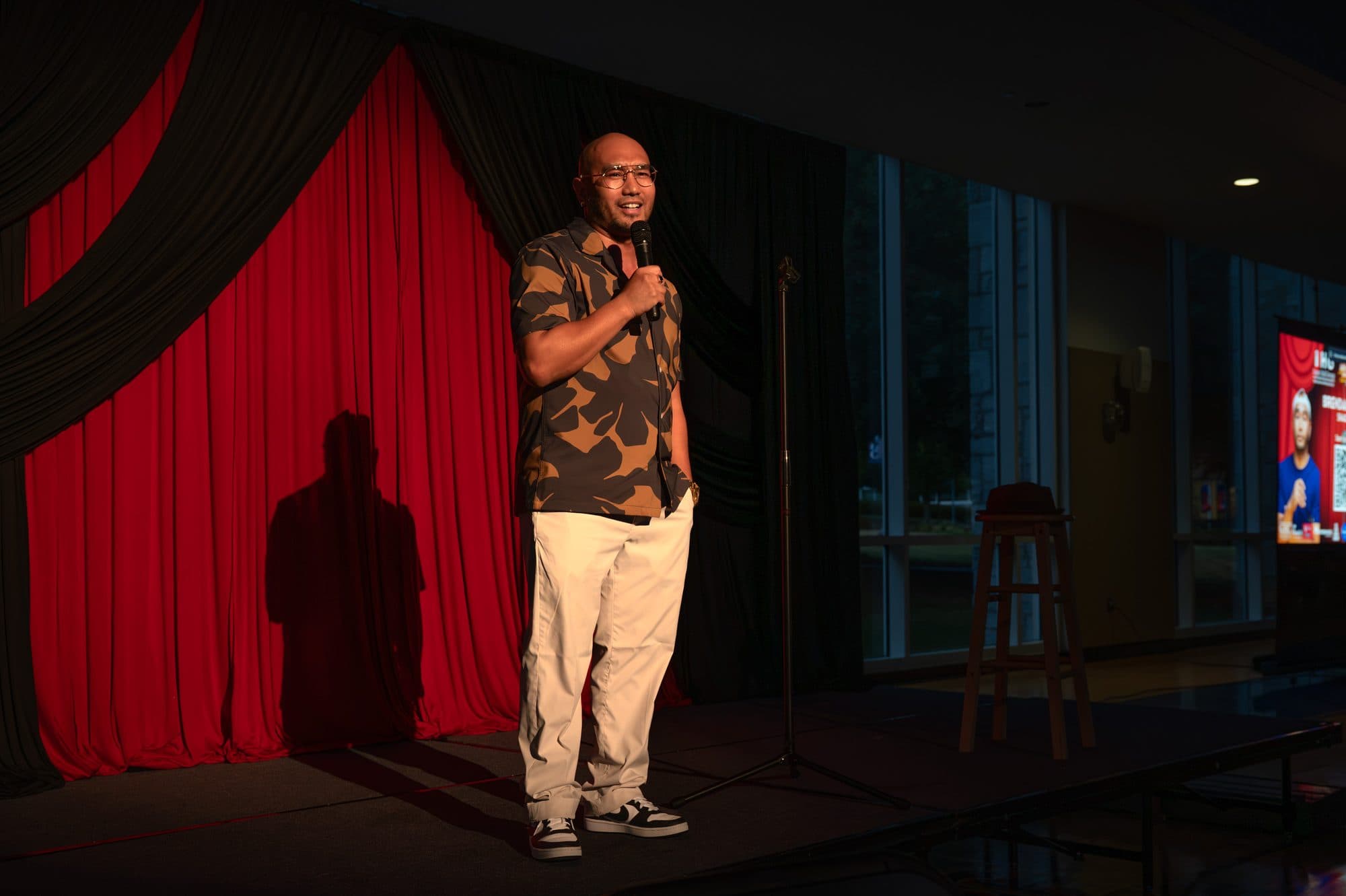 Comedian performing a stand-up set on stage at Mic Drop Masters 2026.