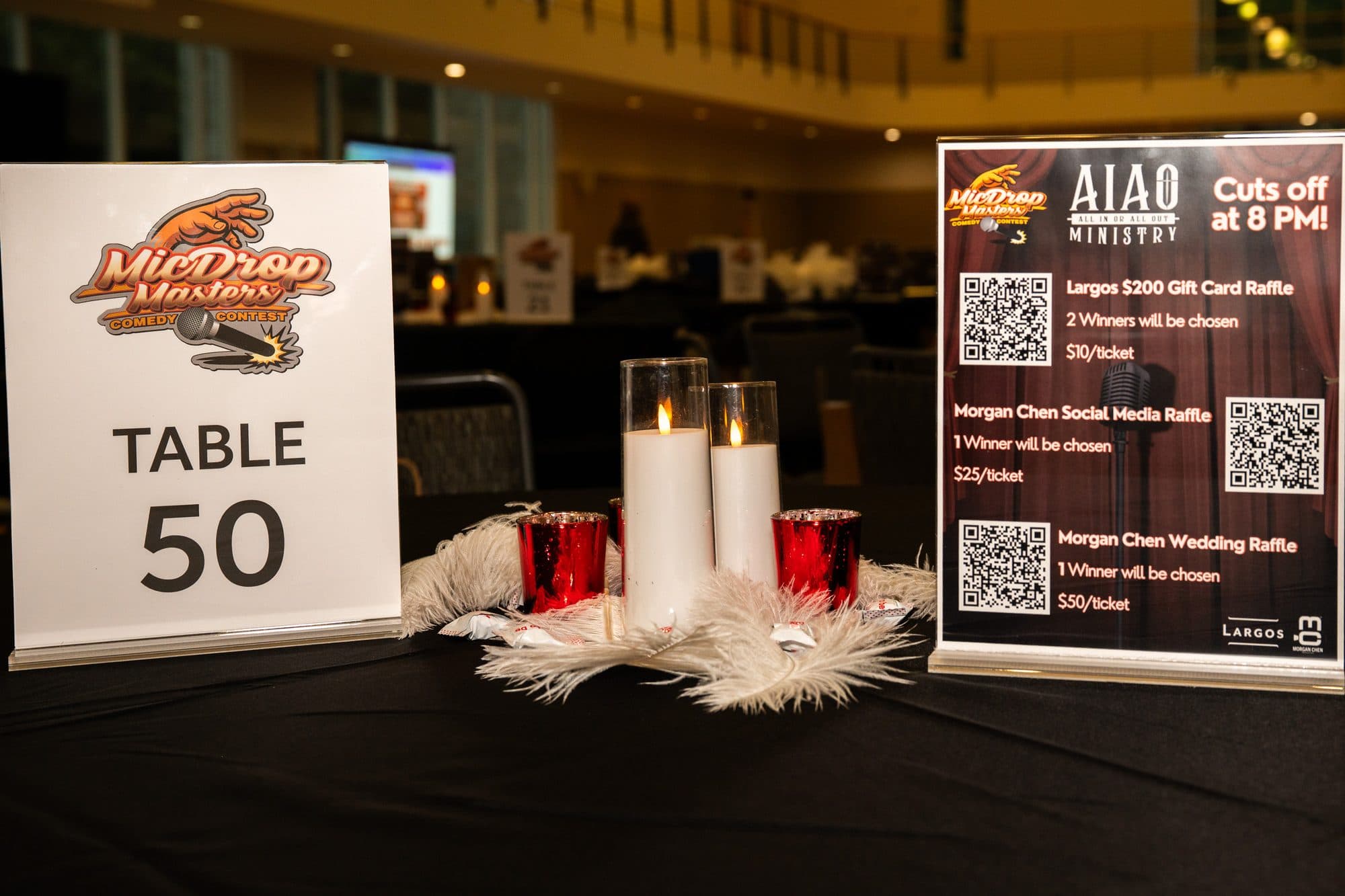 Event merchandise and signage at Mic Drop Masters 2026.