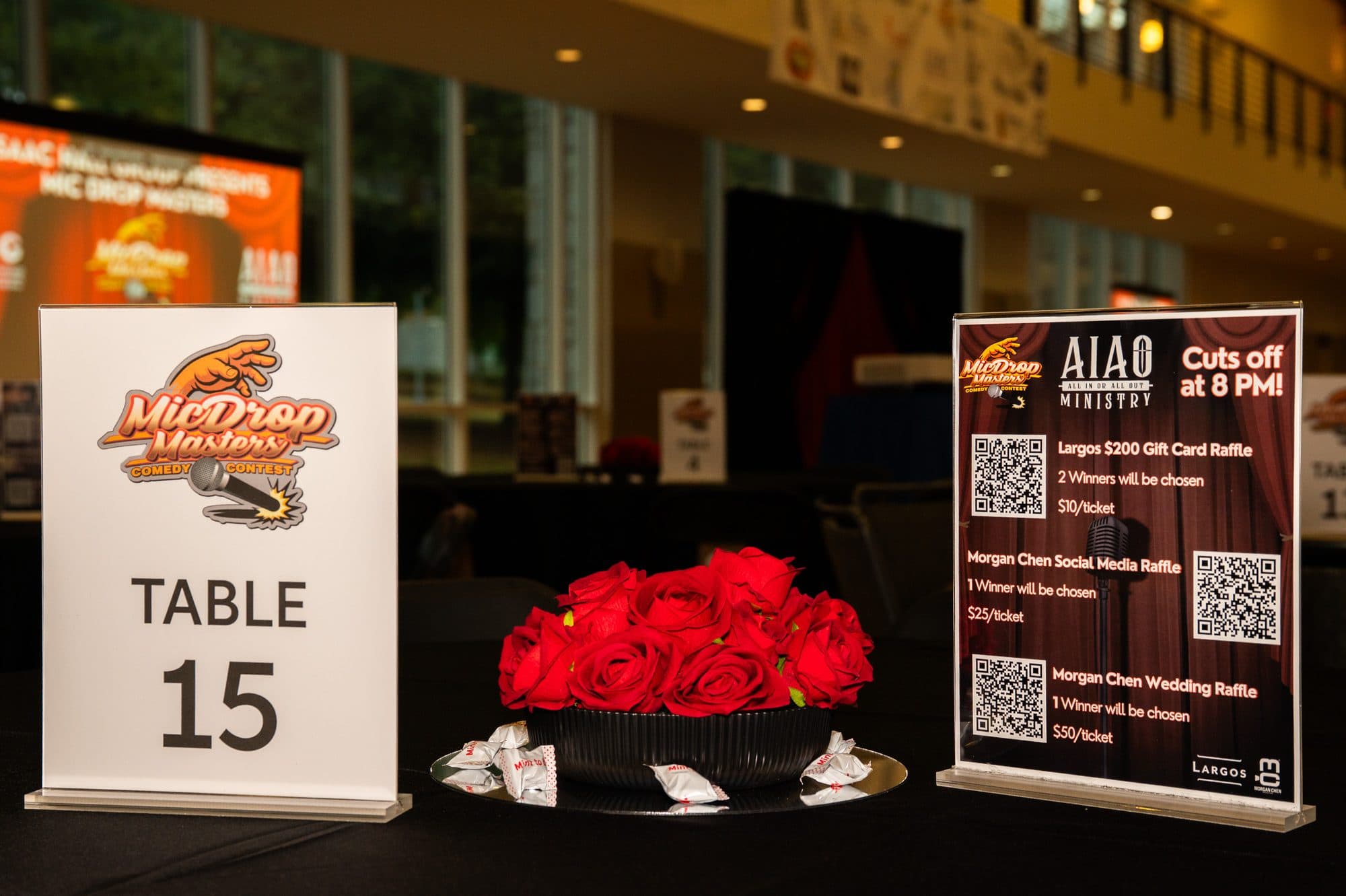 Event merchandise and signage at Mic Drop Masters 2026.